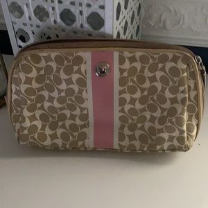 Pink , beige and white coach makeup bag